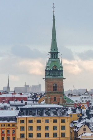 STOCKHOLM, SWEDEN - JAN 8, 2015: View over Stockholm Old Town with snowy roofs. Tyska kyrkanのeditorial素材