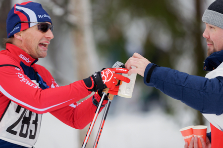 STOCKHOLM, SWEDEN - JAN 24, 2016: Skiiers taking refreshing drinks at the Ski Marathon in nordic skiing classic style.のeditorial素材