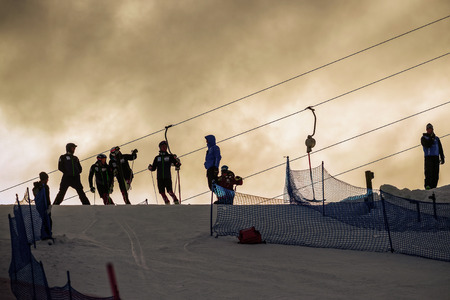STOCKHOLM, SWEDEN - FEB 23, 2016: Silhouettes at the lift in the FIS SKI WORLD CUP at Hammarbybacken in Stockholmのeditorial素材