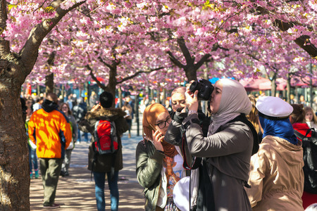 STOCKHOLM, SWEDEN - APRIL 29, 2016: Springtime in Kungstradgarden with happy people during lunchtime...