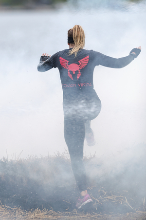 STOCKHOLM, SWEDEN - MAY 14, 2016 Tough Viking around Stockholm Stadion with the water and fire obstacle.のeditorial素材