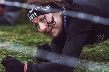 STOCKHOLM, SWEDEN - MAY 14, 2016 Tough Viking obstacle course around Stockholm Stadion with the barbed wire obstacle.のeditorial素材