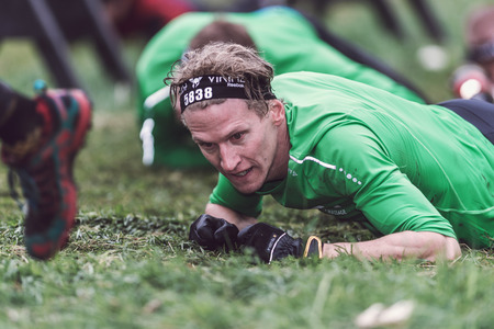 STOCKHOLM, SWEDEN - MAY 14, 2016 Tough Viking obstacle course around Stockholm Stadion with the barbed wire obstacle.のeditorial素材