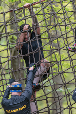STOCKHOLM, SWEDEN - MAY 14, 2016 Net climb at Tough Viking obstacle course around Stockholm Stadion.のeditorial素材