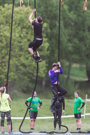 STOCKHOLM, SWEDEN - MAY 14, 2016 Tough Viking obstacle course around Stockholm Stadion with the rope climbing obstacle.のeditorial素材