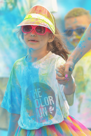 STOCKHOLM, SWEDEN - MAY 22, 2016: Girl with her parent at the last blue station at Color Run Tropicolor world tour in Stockholmのeditorial素材