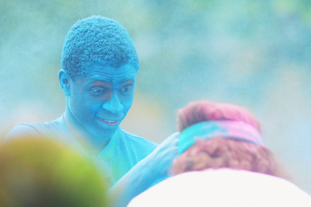 STOCKHOLM, SWEDEN - MAY 22, 2016: Official spraying color at runners at the last blue station at Color Run Tropicolor world tour in Stockholmのeditorial素材