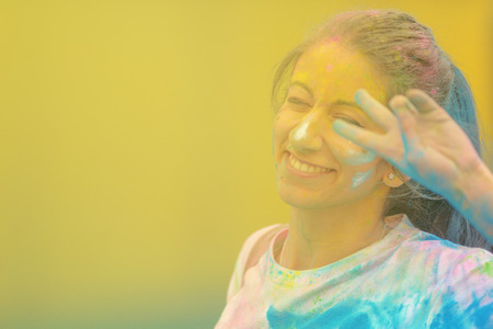 STOCKHOLM, SWEDEN - MAY 22, 2016: Happy female doing a sign at the last blue station at Color Run Tropicolor world tour in Stockholmのeditorial素材