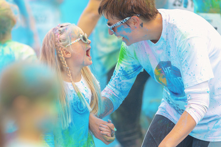 STOCKHOLM, SWEDEN - MAY 22, 2016: Girl with her parent at the last blue station at Color Run...