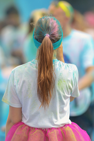 STOCKHOLM, SWEDEN - MAY 22, 2016: Girl searching for friends at the last blue station at Color Run Tropicolor world tour in Stockholmのeditorial素材