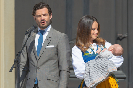 STOCKHOLM, SWEDEN - JUNE 6, 2016: Prince Carl Philip and Princess Sofia with their newborn Prince Alexander invites the public to the royal castle during the national celebration day, 6th of June.のeditorial素材