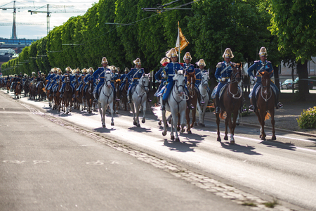 STOCKHOLM, SWEDEN - JUNE 6, 2016: Royal cortege with mounted guards and music corps. Swedish Royalty on the way to Skansen.のeditorial素材