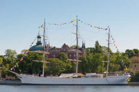 STOCKHOLM, SWEDEN - JUNE 6, 2016: The Af Chapman the great hostel ship in the Stockholm City. During the national day with flagsのeditorial素材