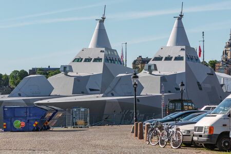 STOCKHOLM, SWEDEN - JUNE 6, 2016: Two military stealth corvettes in the Visby class embarked in Stockholm. HMS Helsingborgin front.のeditorial素材