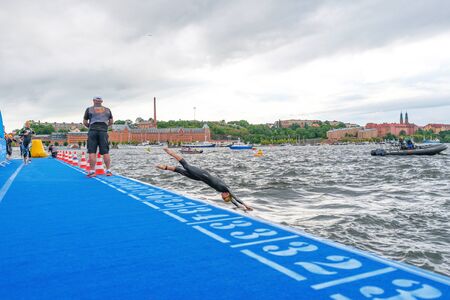 STOCKHOLM, SWEDEN - JULY 02, 2016: Second lap at the swimming in the Women ITU Triathlon event in Stockholm. Cloudy weather.のeditorial素材