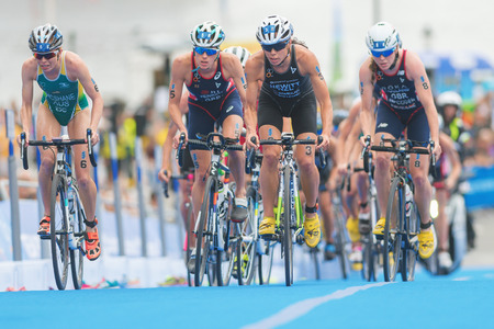 STOCKHOLM, SWEDEN - JULY 02, 2016: Group of cyclists at the last lap before the transition between cycling and running at the Women ITU Triathlon event in Stockholm.のeditorial素材