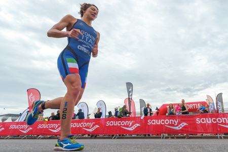 STOCKHOLM, SWEDEN - JULY 02, 2016: Charlotte Bonin (ITA) running in wide angle view at the Women ITU Triathlon event in Stockholm.のeditorial素材