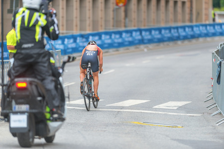 STOCKHOLM, SWEDEN - JULY 02, 2016: Leader Flora Duffy (BER) followed of a camerateam on MC at the cycling in the Women ITU Triathlon event in Stockholm.のeditorial素材