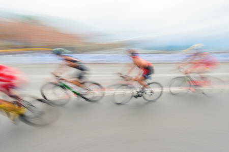 STOCKHOLM, SWEDEN - JULY 02, 2016: Colorful unfocused motion captures of the cycling at the Mens ITU Triathlon event in Stockholm.のeditorial素材