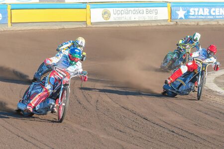 HALLSTAVIK, SWEDEN - JULY 19, 2016: Speedway racers in the second curve between Rospiggarna and Lejonen at HZ Bygg Arena in Hallstavik.のeditorial素材