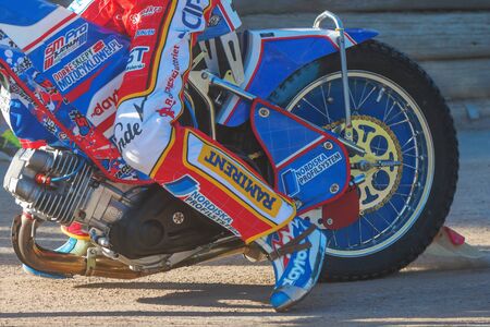 HALLSTAVIK, SWEDEN - JULY 19, 2016: Closeup of the engine and back wheel of a speedway motorcycle at HZ Bygg Arena in Hallstavik.のeditorial素材