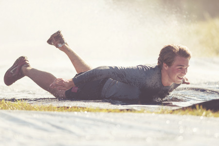 STOCKHOLM, SWEDEN - AUG 27, 2016: Giant hill slide at the Tough Viking event at Gardet in Stockholm. Filter appliedのeditorial素材