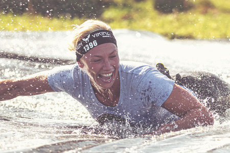 STOCKHOLM, SWEDEN - AUG 27, 2016: Giant hill slide at the Tough Viking event at Gardet in Stockholm. Filter appliedのeditorial素材