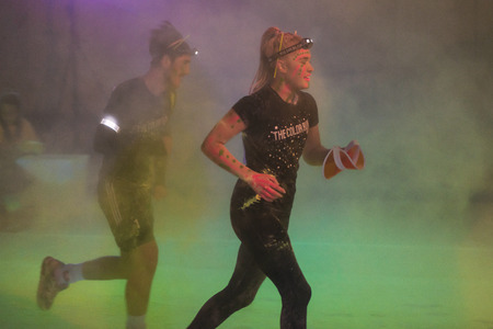 STOCKHOLM, SWEDEN - SEPT 18, 2016: Colorful happy people at yellow station in the Color Run Night...