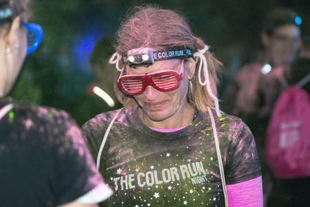 STOCKHOLM, SWEDEN - SEPT 18, 2016: Friends with colorful glasses at the Color Run Night Edition in Stockholm.のeditorial素材