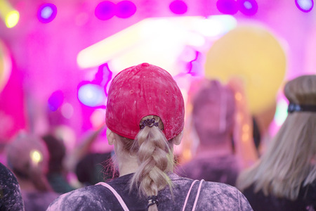 STOCKHOLM, SWEDEN - SEPT 18, 2016: Colorful happy people at the Color Run Night Edition in...
