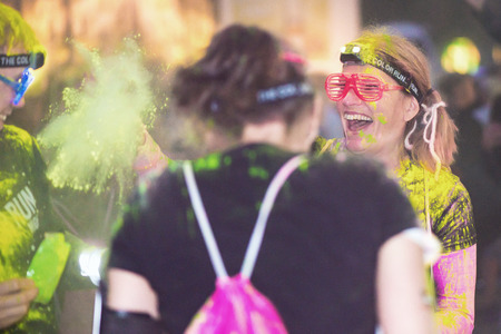 STOCKHOLM, SWEDEN - SEPT 18, 2016: Friends with colorful glasses at the Color Run Night Edition in...