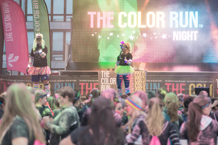 STOCKHOLM, SWEDEN - SEPT 18, 2016: Presenters at the stage before the race at the Color Run Night Edition in Stockholm.のeditorial素材