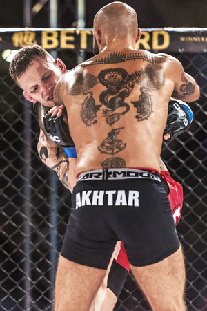 STOCKHOLM - OCT 8, 2016: Martin Akhtar vs Declan Williams at Superior Challenge 14 at Eriksdalshallen in Stockholm.のeditorial素材