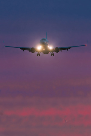 ARLANDA, SWEDEN - SEPT 6, 2016: Front view of a passenger aircraft with a que of other planes at...
