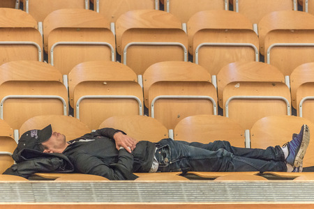 STOCKHOLM, SWEDEN - NOV 19, 2016: Spectator relaxing at the table tennis tournament SOC at the arena Eriksdalshallen in Stockholm.のeditorial素材