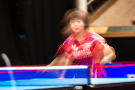 STOCKHOLM, SWEDEN - NOV 19, 2016: Sakura Mori (JPN) vs Jihee Jeon (KOR) in the table tennis tournament SOC in motionblur.のeditorial素材