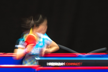 STOCKHOLM, SWEDEN - NOV 19, 2016: Sakura Mori (JPN) vs Jihee Jeon (KOR) in the table tennis tournament SOC in motionblur.のeditorial素材