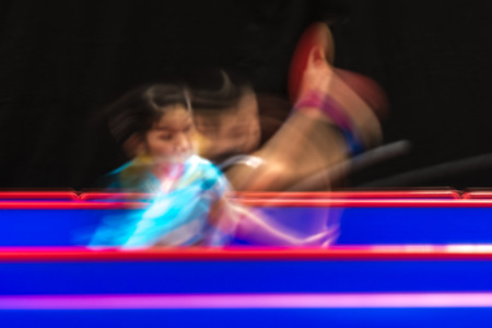 STOCKHOLM, SWEDEN - NOV 19, 2016: Sakura Mori (JPN) vs Jihee Jeon (KOR) in the table tennis tournament SOC in motionblur.のeditorial素材