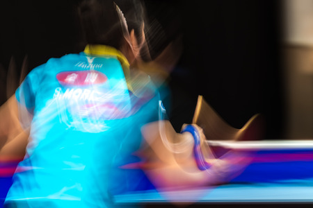 STOCKHOLM, SWEDEN - NOV 19, 2016: Sakura Mori (JPN) vs Jihee Jeon (KOR) in the table tennis tournament SOC in motionblur.のeditorial素材