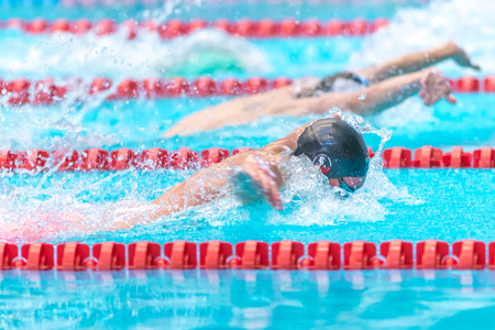 STOCKHOLM, SWEDEN - NOV 5, 2016: Sideview of butterfly swim at the National Swedish swim championships at Eriksdalsbadet.のeditorial素材