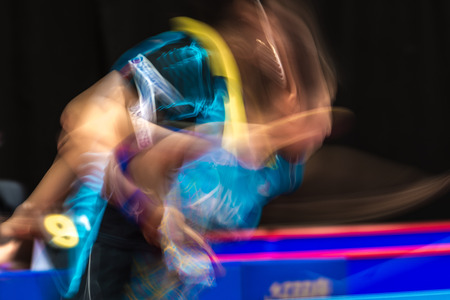 STOCKHOLM, SWEDEN - NOV 19, 2016: Sakura Mori (JPN) vs Jihee Jeon (KOR) in the table tennis tournament SOC in motionblur.のeditorial素材
