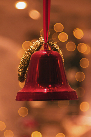 Red bells in a window decoration during christmas with great bokeh. Sweden