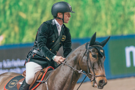 SOLNA, SWEDEN - NOV 27, 2016: Peder Fredricson at the Friends Christmas Speed Jumping in the Sweden International Horse Show at Friends arena.のeditorial素材