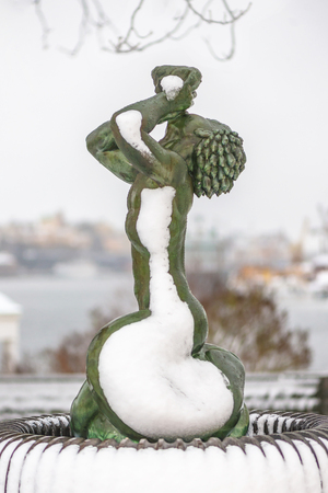 STOCKHOLM, SWEDEN, FEB 22, 2017: Sculpture in bronze of Triton by Carl Milles at Prince Eugens Waldermarsudde during snowy weather.のeditorial素材