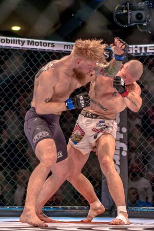 STOCKHOLM, SWEDEN - APRIL 1, 2017: MMA fight between Zebaztian Kadestam vs Juho Valamaa at Superior Challenge 15 at Eriksdalshallen in Stockholm. Winner Valamaa via submissionのeditorial素材