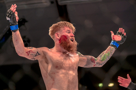 STOCKHOLM, SWEDEN - APRIL 1, 2017: MMA fight between Zebaztian Kadestam vs Juho Valamaa at Superior Challenge 15 at Eriksdalshallen in Stockholm. Winner Valamaa via submissionのeditorial素材