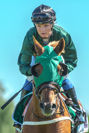 STOCKHOLM, SWEDEN - JUN 6, 2017: Jockey and racehorse at Nationaldagsgaloppen at Gardet.のeditorial素材