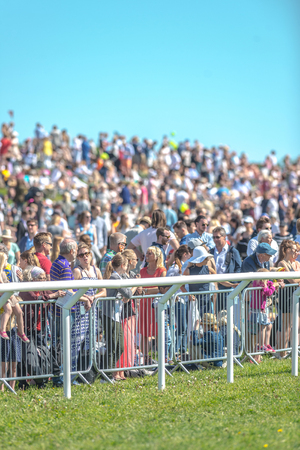 STOCKHOLM, SWEDEN - JUN 6, 2017: Spectators at the Nationaldagsgaloppen at Gardet.のeditorial素材