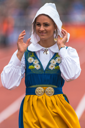 STOCKHOLM, SWEDEN - JUNE 3, 2017: Hurdle runner Elin Westerlund in traditional swedish dress at Stockholm Marathon.のeditorial素材