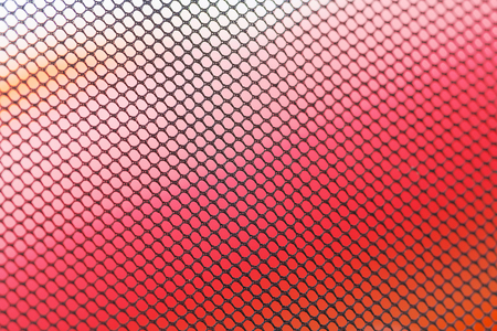 STOCKHOLM, SWEDEN - JULY 22, 2017: Backdrop of a net with colorful background at the color obstacle rush at Gardet in Stockholm. 15 obstacles, 6 colors and 5k running.の写真素材